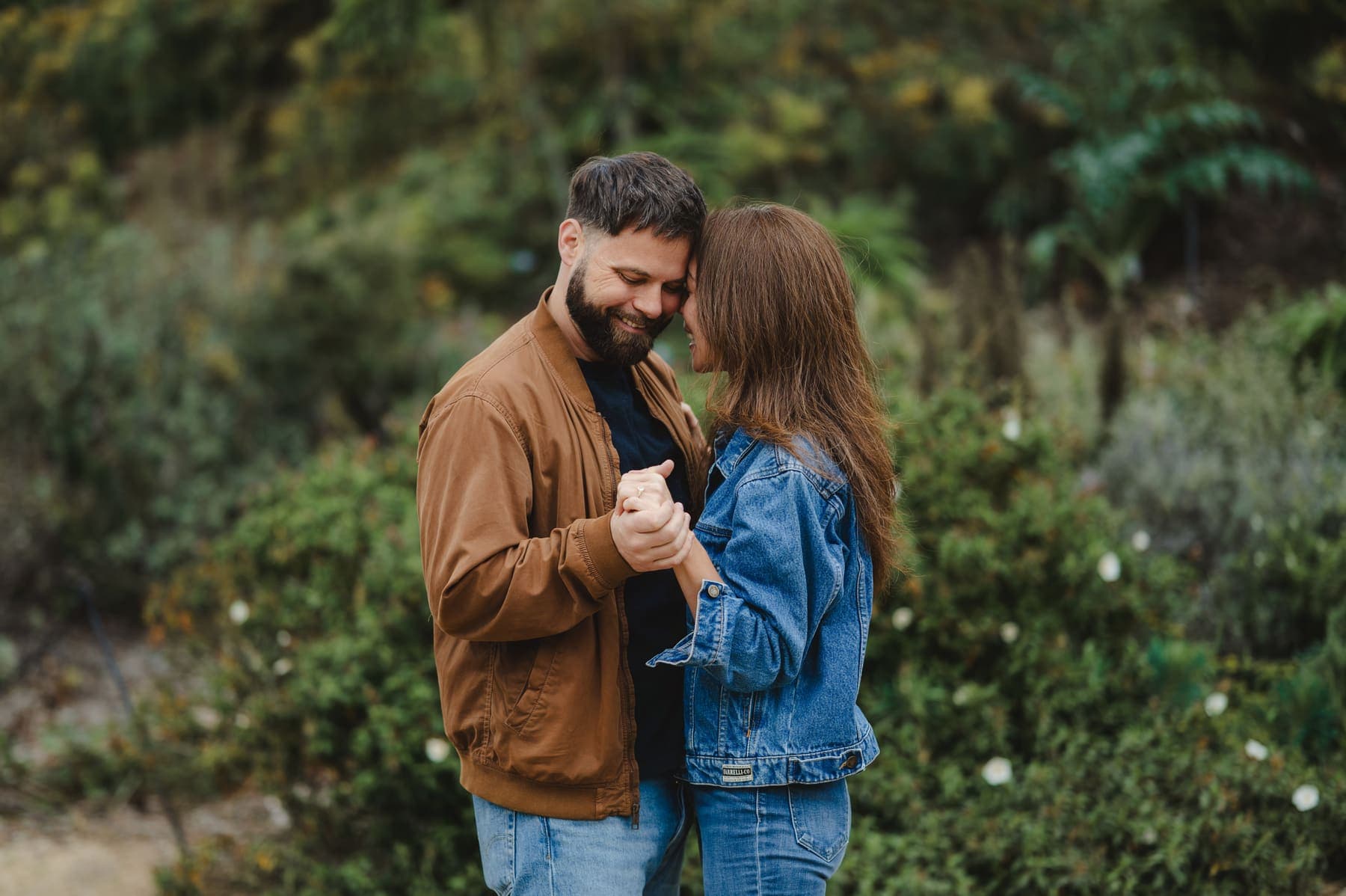 Rebecca and Shawn embracing just after the proposal